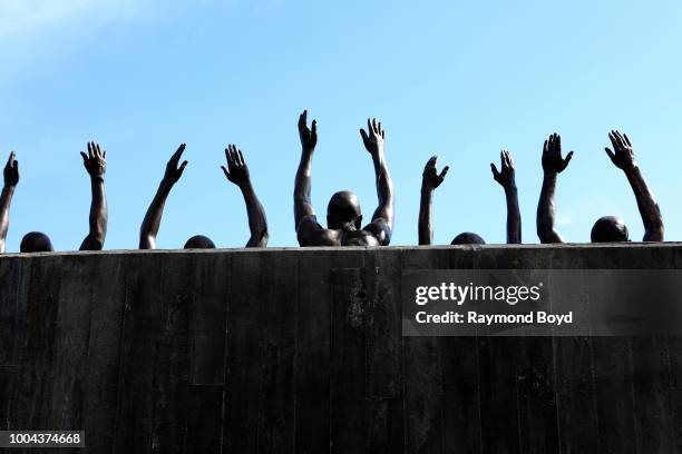 Hank Willis Thomas' 'Raise Up' statue, which depicts contemporary issues of police violence and racially biased criminal justice, stands inside The...