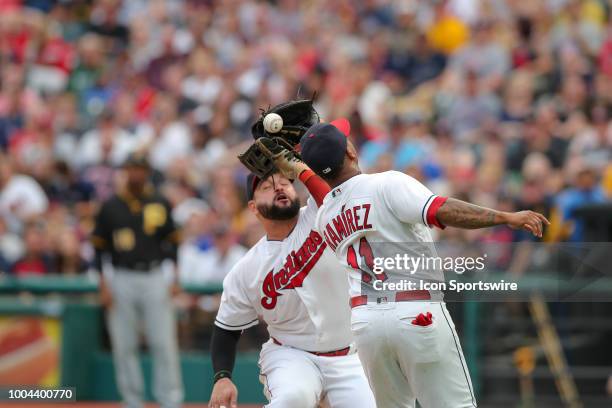 Cleveland Indians first baseman Yonder Alonso and Cleveland Indians third baseman Jose Ramirez collide as they go for a infield popup off the bat of...