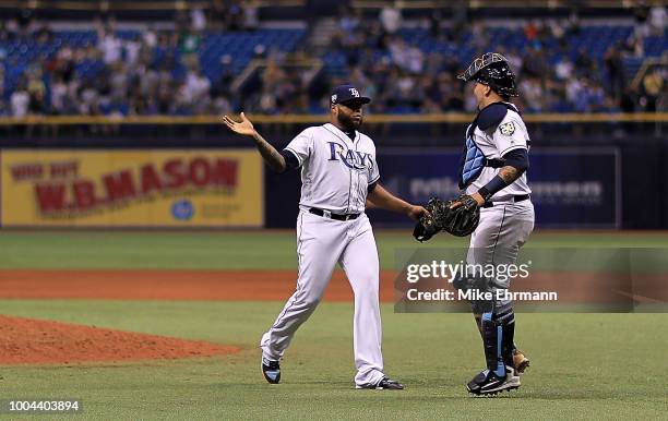 Jose Alvarado and Jesus Sucre of the Tampa Bay Rays celebrate winning a game against the New York Yankees at Tropicana Field on July 24, 2018 in St...