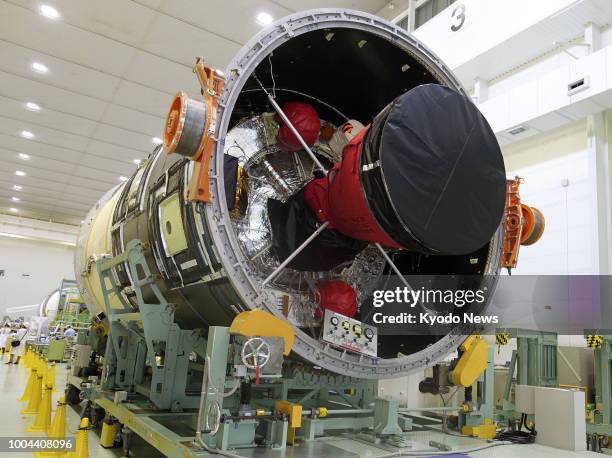 Mitsubishi Heavy Industries Ltd. Unveils the fuselage of an H-2B rocket to the press at the company's factory in Tobishima, Aichi Prefecture, on July...