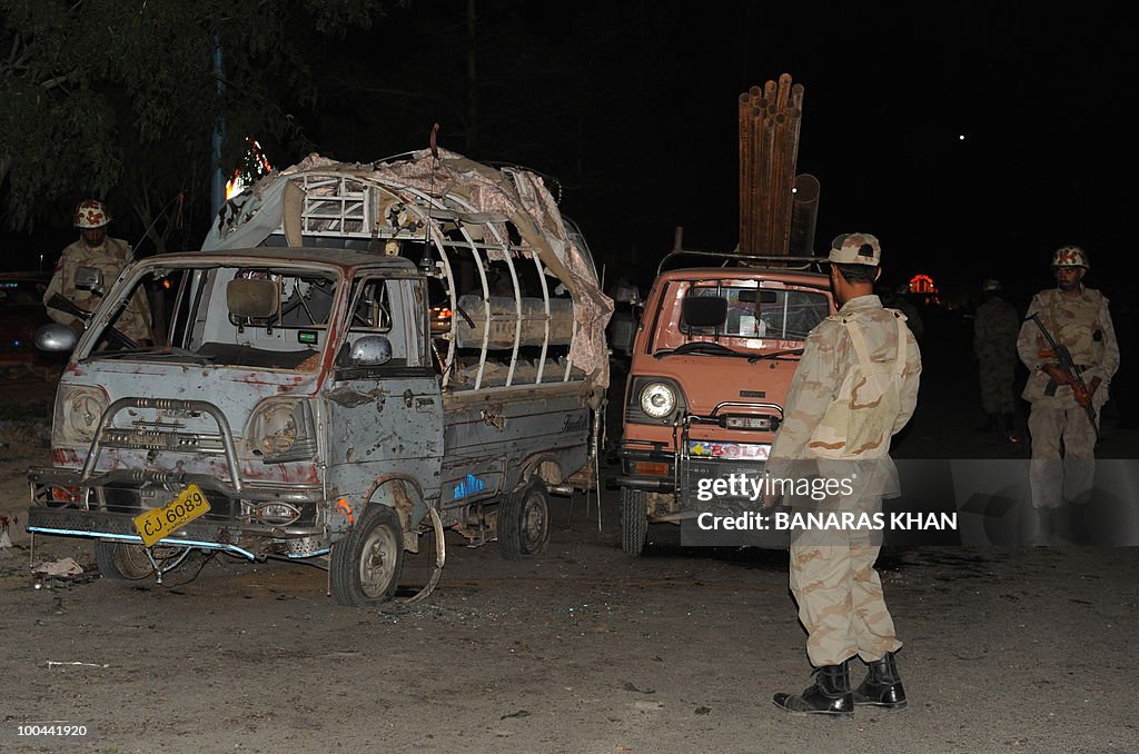 Pakistani security personnel gather as t