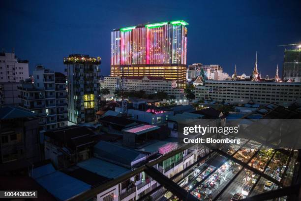 Commercial and residential buildings stand illuminated at night in Phnom Penh, Cambodia, on Sunday, July 22, 2018. Asias longest-serving Prime...