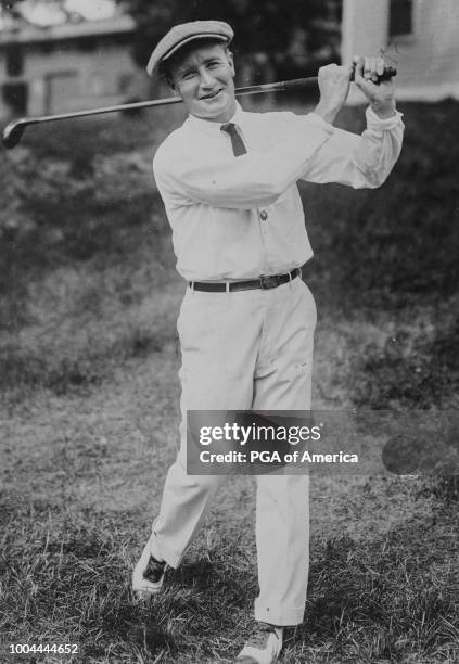 Jerome D. Travers hits a tee shot in 1915."n -