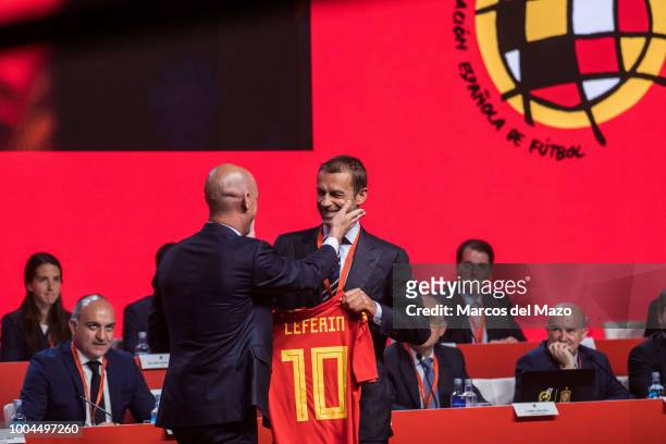 President of Spanish Football Federation Luis Rubiales gives national football shirt to UEFA president Aleksander Ceferin during the RFEF general...
