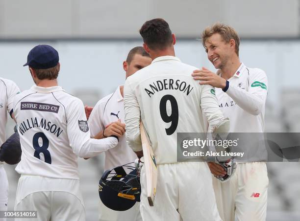 Joe Root of Yorkshire and James Anderson of Lancashire shake hands after the Specsavers Championship Division One match between Lancashire and...