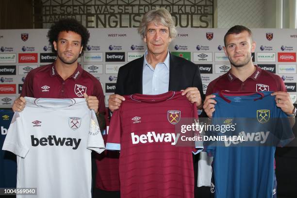 West Ham United's Chilean manager Manuel Pellegrini , West Ham United's Brazlian midfielder Felipe Anderson and West Ham United's English midfielder...