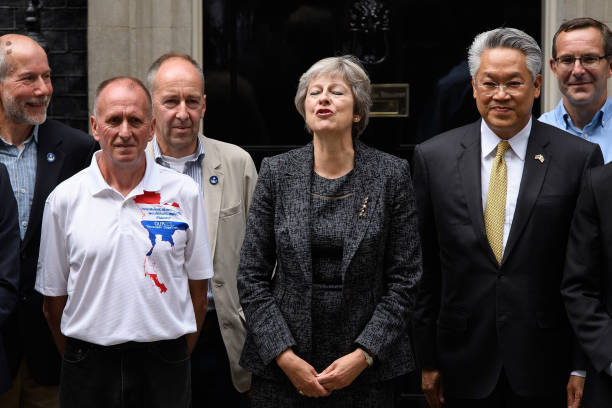 GBR: Theresa May Hosts The Divers Who Rescued The Trapped Thai Boys Football Team