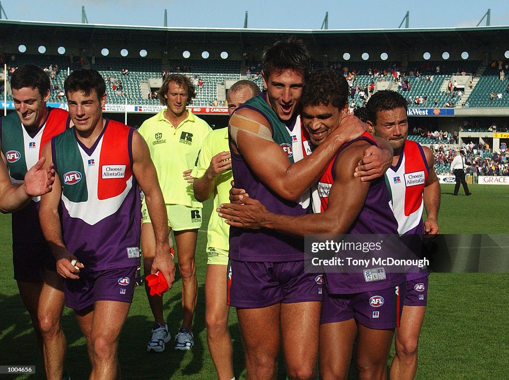 07 Apr 2002:  Matthew Pavlich #29 and Dale Kickett #11 (right) for the Fremantle Dockers celebrate t