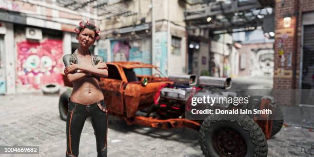 quirky older woman in hair curlers with rusty super-car in futuristic back streets - cars on motor way stockfoto's en -beelden