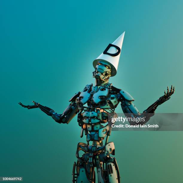 robot wearing dunce hat stands with arms out - dunce cap stock-fotos und bilder