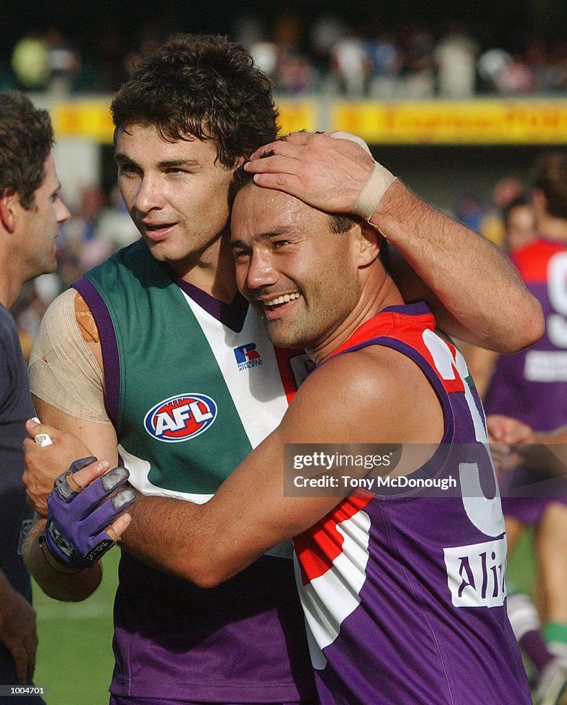 07 Apr 2002:  Troy Longmuir #21 and Peter Bell #32  for the Fremantle celebrate after winning round 