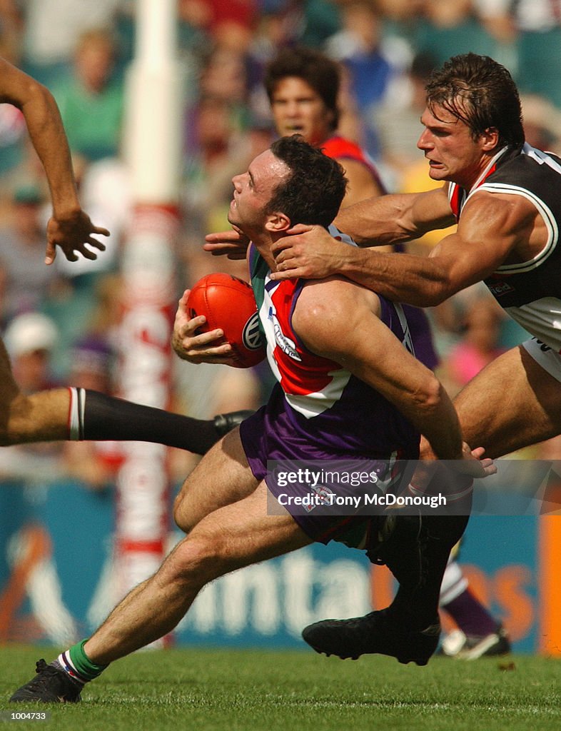 07 Apr 2002:  Jason Norrish #25 for Fremantle is caught by Aaron Hamill #2 for St Kilda during the r