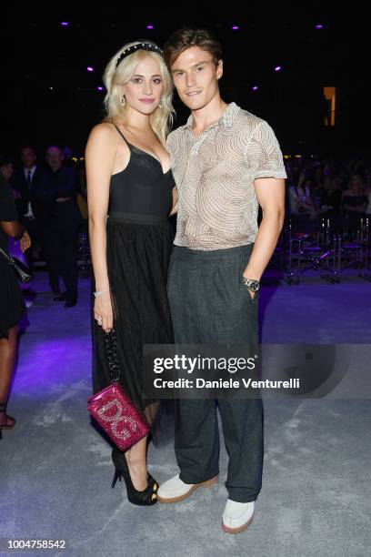 Pixie Lott and Oliver Cheshire attend the Tezenis show on July 24, 2018 in Verona, Italy.