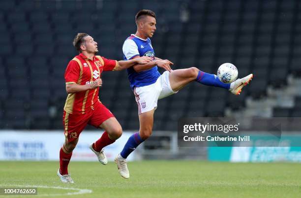 Jonas Knudsen of Ipswich Town gets past Peter Pawlett of MK Dons during the Pre Season Friendly between Milton Keynes Dons and Ipswich Town at...