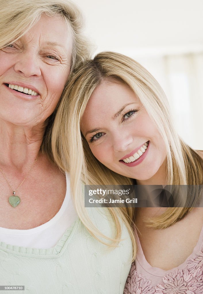 Portrait of mother and daughter, smiling