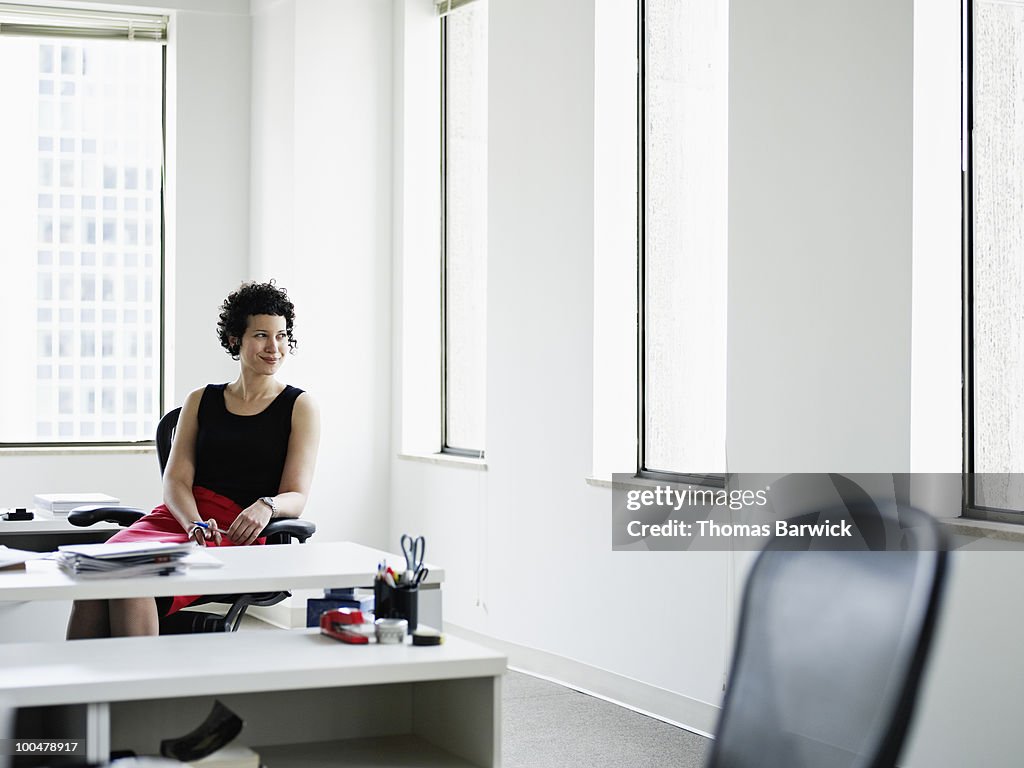 Businesswoman sitting at desk in office