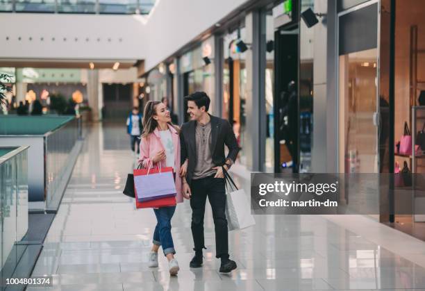 couple in the mall - couple shopping in shopping mall stock pictures, royalty-free photos & images