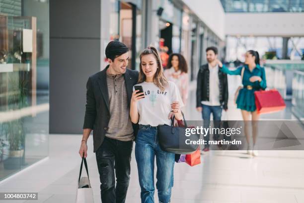 friends in the mall - couple walking shopping stock pictures, royalty-free photos & images