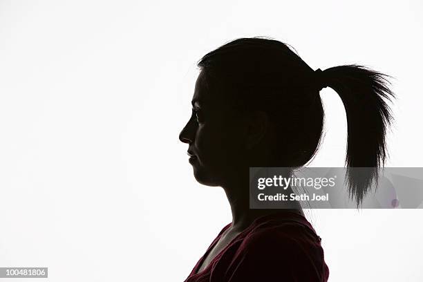 young woman in profile - arab woman silhouette stock pictures, royalty-free photos & images