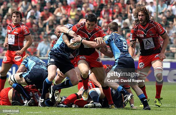 Sonny Bill Williams of Toulon is tackled by Martyn Williams and Richie Rees during the Amlin Challenge Cup Final between Toulon and Cardiff Blues at...