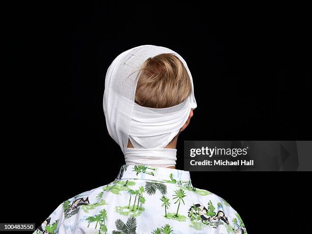 young boy in head bandage - head bandage stock-fotos und bilder