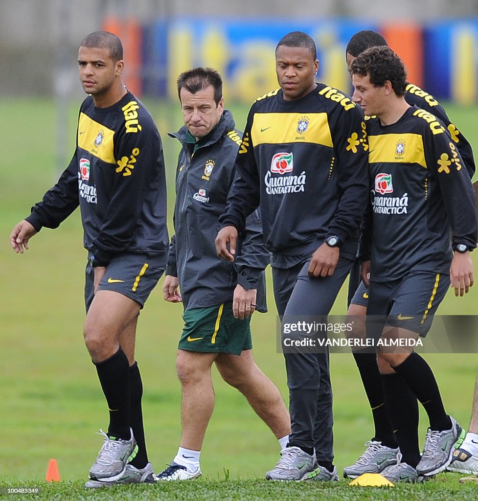 Brazilian coach Dunga (2nd-L) looks at h