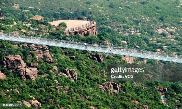 The 188-metre-long 5D Glass Suspension Bridge is seen at Wan'anshan Grand Canyon on July 21, 2018 in Luoyang, Henan Province of China. The 5D Glass...
