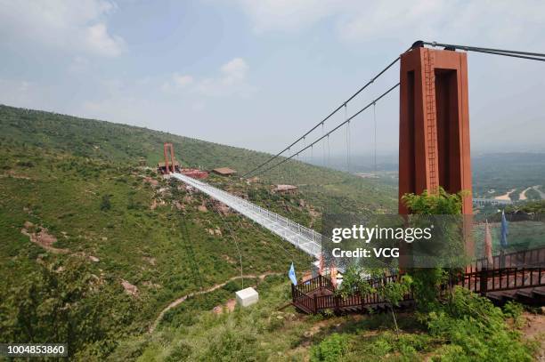 The 188-metre-long 5D Glass Suspension Bridge is seen at Wan'anshan Grand Canyon on July 21, 2018 in Luoyang, Henan Province of China. The 5D Glass...