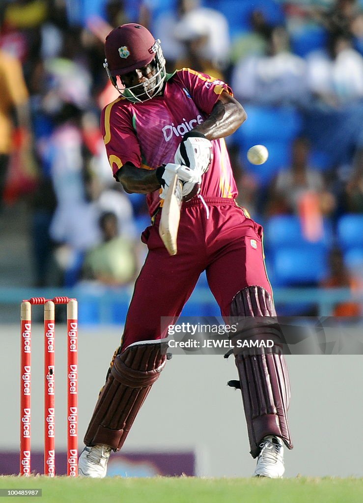 West Indies cricketer Darren Sammy hits