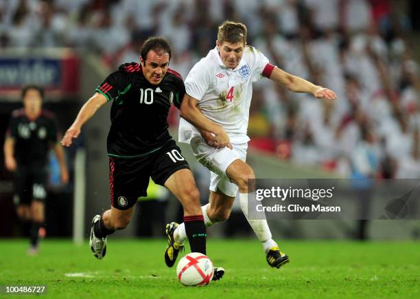 Cuauhtemoc Blanco of Mexico battles for the ball with Steven Gerrard of England during the International Friendly match between England and Mexico at...