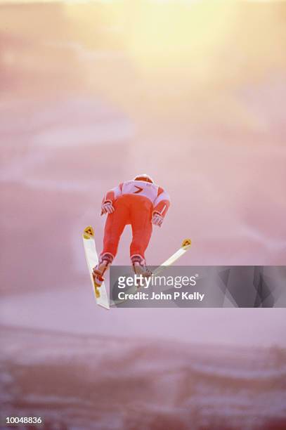 ski jumper in mid-air - ski jumping stock-fotos und bilder