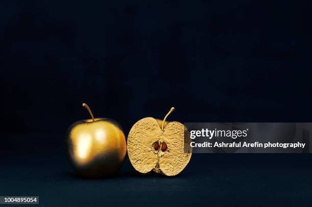gold apples - desire concept stock pictures, royalty-free photos & images