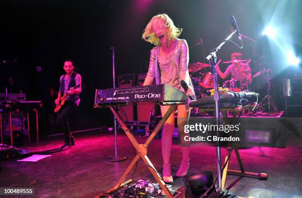 James Shaw and Emily Haines of Metric perform on stage at Shepherds Bush Empire on May 24, 2010 in London, England.