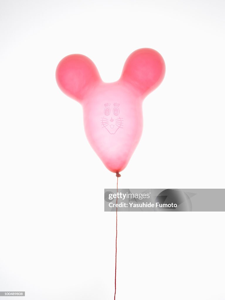 Rabbit-shaped red balloon.