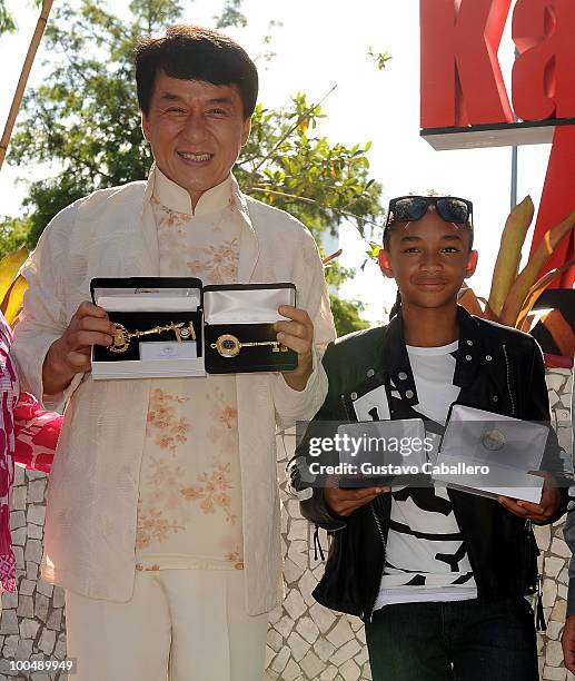 Actors Jackie Chan and Jaden Smith hold keys to the cities of Miami and Miami Beach that they received before a special screening of Columbia...