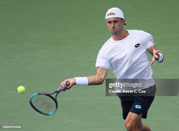 Tim Smyczek returns a forehand to Mischa Zverev of Germany during the BB&T Atlanta Open at Atlantic Station on July 24, 2018 in Atlanta, Georgia.