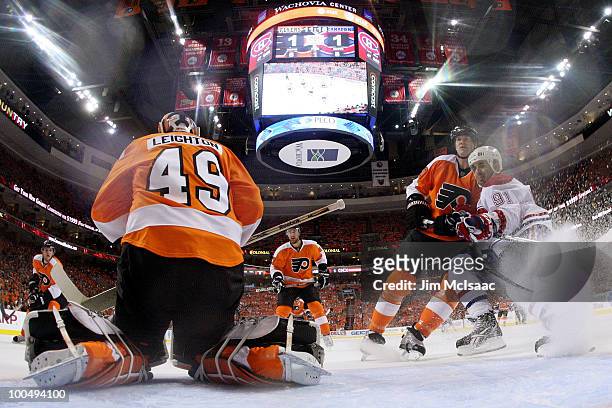 Michael Leighton of the Philadelphia Flyers makes a save in front of Scott Gomez of the Montreal Canadiens in Game 5 of the Eastern Conference Finals...