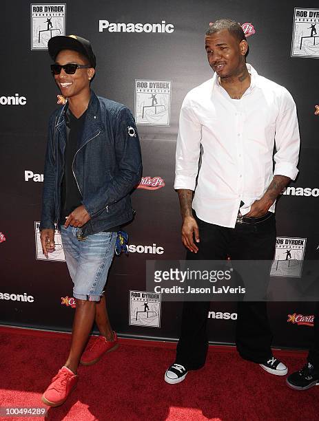 Musician Pharrell Williams and rapper The Game attend the "Sk8 For Life" benefit at Fantasy Factory on May 22, 2010 in Los Angeles, California.