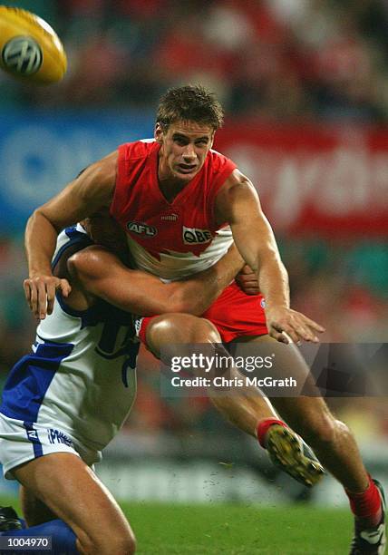 Jason Saddington of the Swans gets a kick away during the round 4 AFL match between the Sydney Swans and the Kangaroos held at the Sydney Cricket...