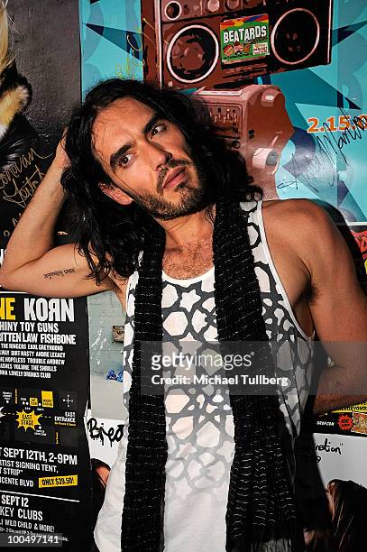 Actor Russell Brand poses backstage following a concert with the band Infant Sorrow to promote the new film "Get Him To The Greek" at the Roxy...