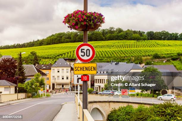 entrance sign to schengen luxembourg - luxemburg stock-fotos und bilder