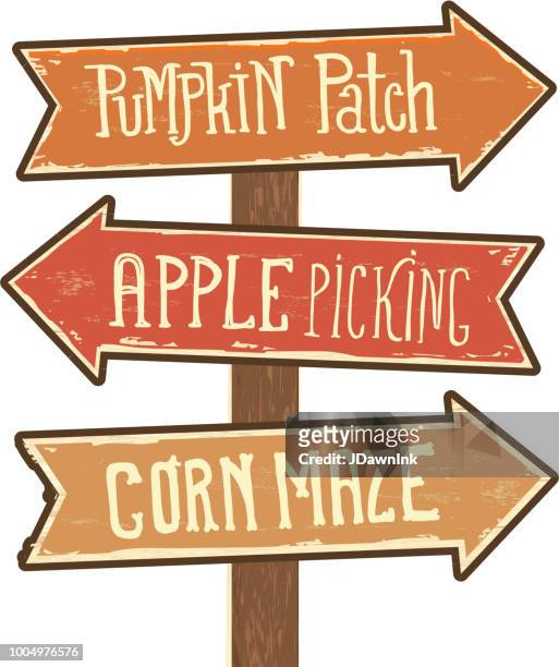 wooden sign post with arrows pointing to pumpkin patch, apple picking and corn maze - traditional festival stock illustrations
