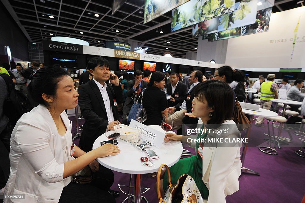 Potential buyers sample wine at VINEXPO