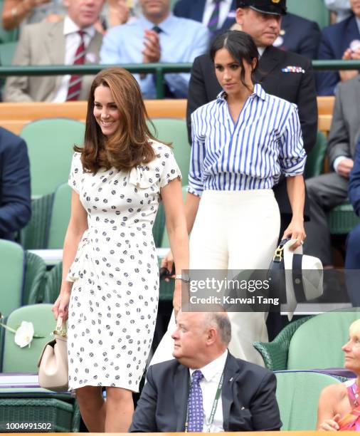 Catherine, Duchess of Cambridge and Meghan, Duchess of Sussex attend day twelve of the Wimbledon Tennis Championships at the All England Lawn Tennis...