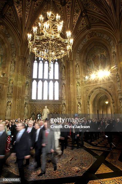 MPs walk through the central lobby from the House of Commons to the House of Lords during the State Opening of Parliament in the Houses of Parliament...