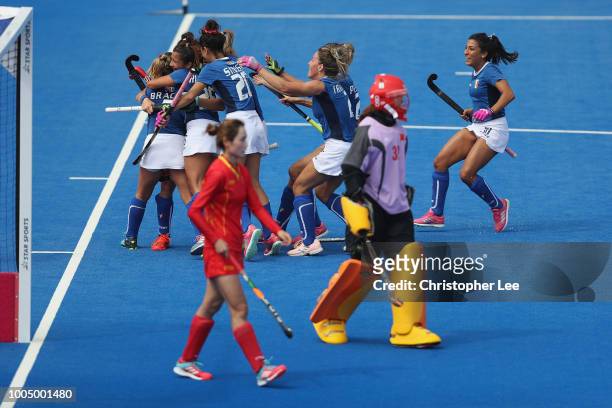 Valentina Braconi of Italy is congratulated after scoring their first goal during the Pool A game between China and Italy of the FIH Womens Hockey...