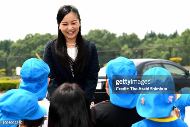 Princess Kako of Akishino smiles as she talks with kindergarten children on arrival at the opening ceremony of the 52nd High School Equestrian...