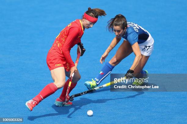 Shumin Wang of China battles with Lara Oviedo of Italy during the Pool A game between China and Italy of the FIH Womens Hockey World Cup at Lee...