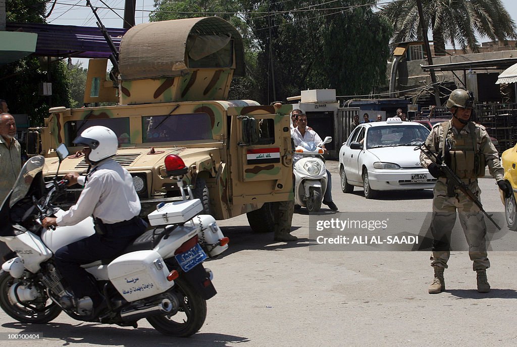 Iraqi soldiers secure an area in Baghdad