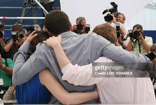 Hungarian director Kornel Mundruczo poses with actor Rudolf Frecska and actress Kitty Csikos during the photocall of "Szelid Teremtes - A...